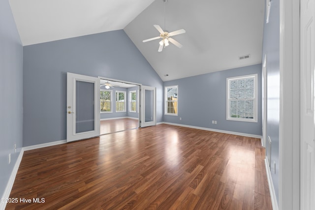 unfurnished living room featuring wood-type flooring, high vaulted ceiling, and ceiling fan