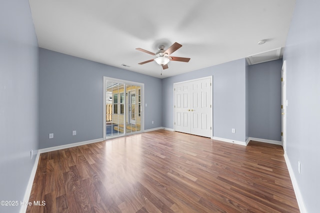 unfurnished bedroom with dark hardwood / wood-style floors, access to outside, ceiling fan, and a closet