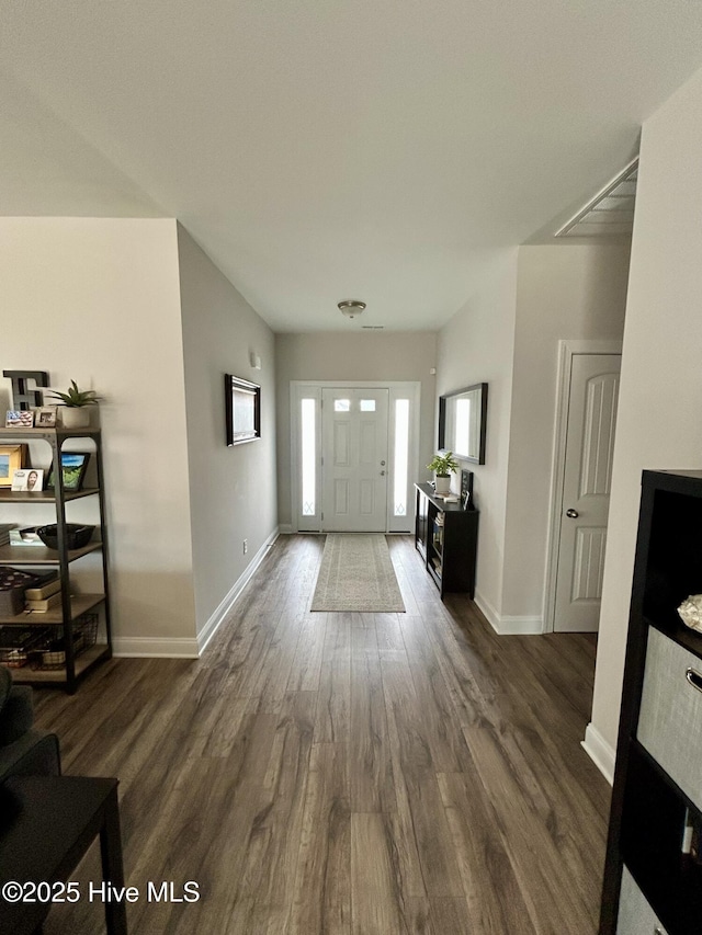 foyer entrance with dark hardwood / wood-style flooring