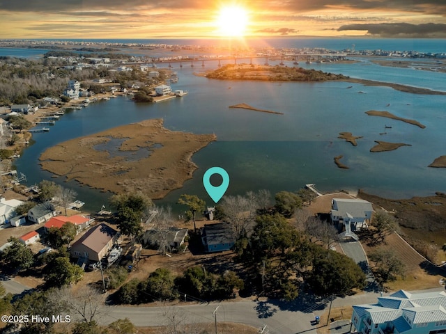 aerial view at dusk with a water view