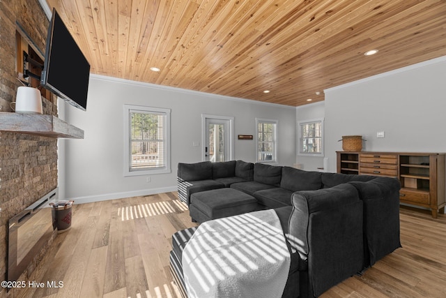 living room featuring crown molding, plenty of natural light, light hardwood / wood-style flooring, and wooden ceiling