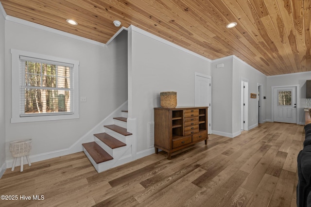 foyer with hardwood / wood-style flooring, ornamental molding, and wood ceiling