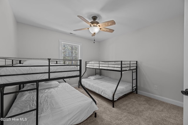 bedroom featuring ceiling fan and carpet flooring