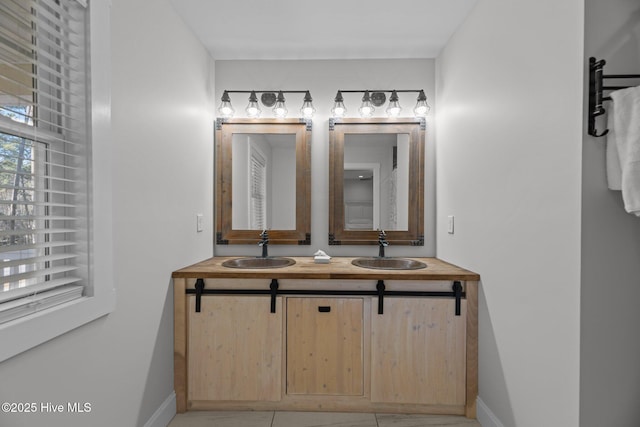 bathroom with vanity and tile patterned flooring