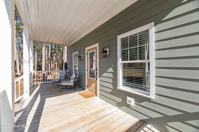 deck featuring covered porch