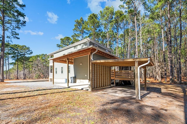 exterior space with a carport