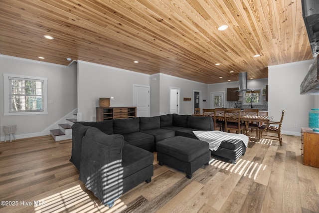 living room featuring ornamental molding, wood ceiling, and light hardwood / wood-style floors