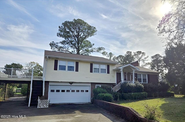 view of front of property with a front lawn and a garage