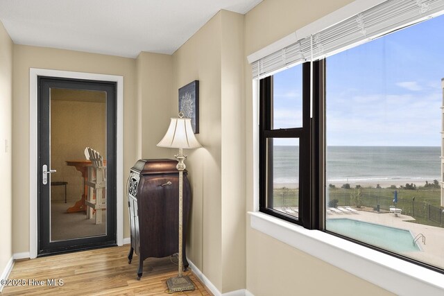 balcony with a view of the beach and a water view