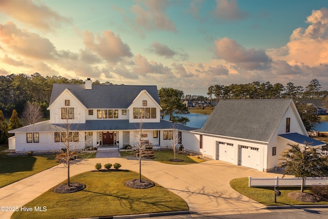 view of front of home featuring a lawn and a garage