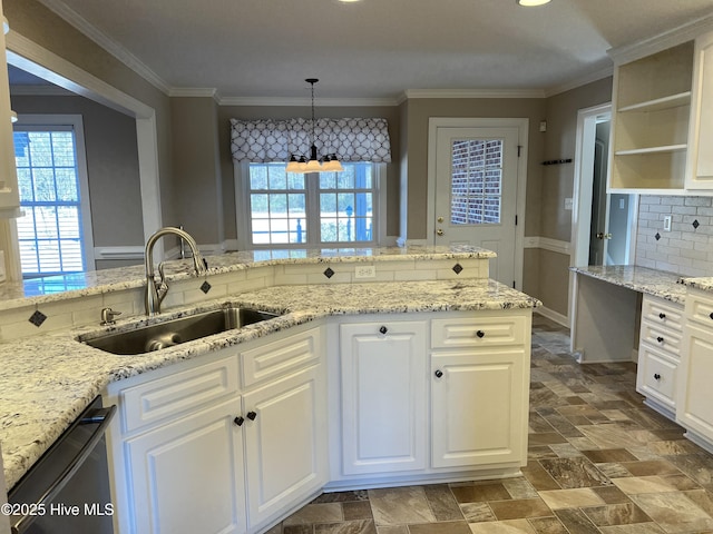 kitchen with sink, white cabinetry, black dishwasher, and hanging light fixtures