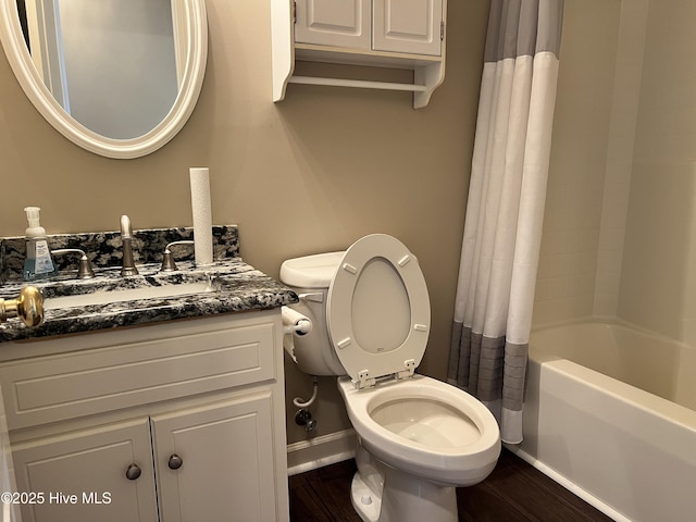 full bathroom featuring toilet, shower / tub combo, wood-type flooring, and vanity