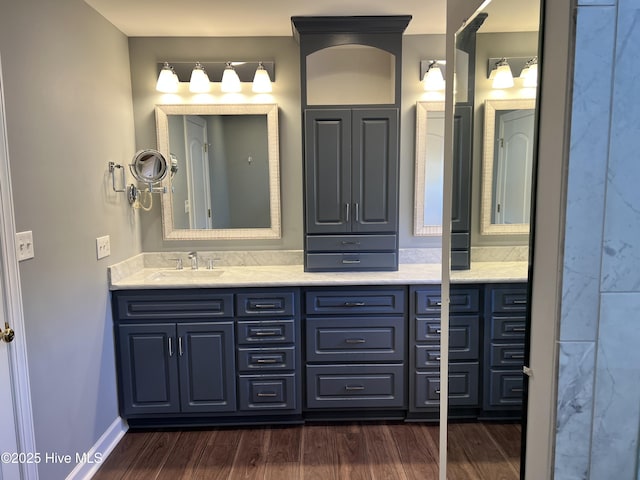 bathroom with vanity and hardwood / wood-style flooring