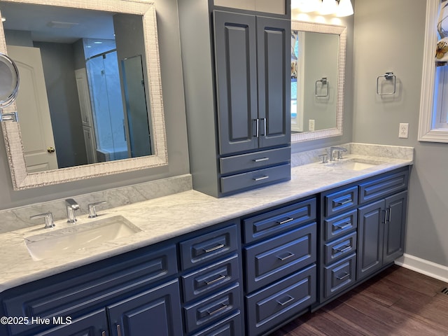 bathroom with vanity and hardwood / wood-style flooring