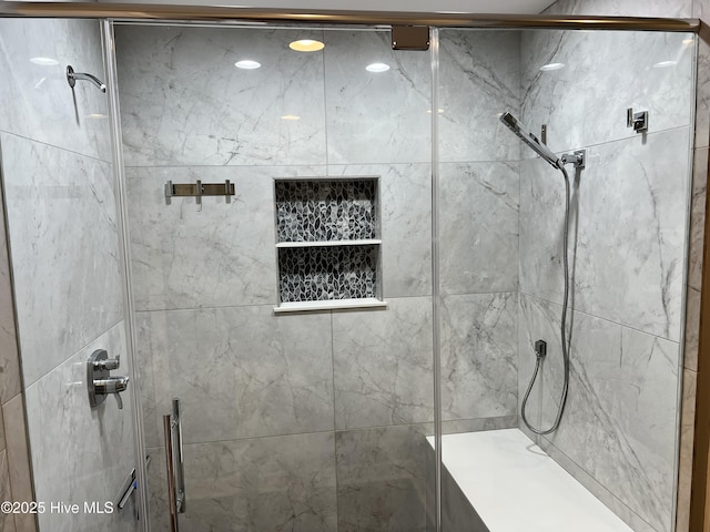 bathroom featuring an enclosed shower