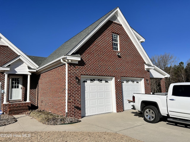 view of side of home featuring a garage