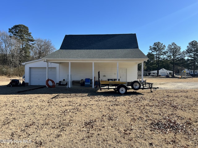 view of outbuilding featuring covered porch