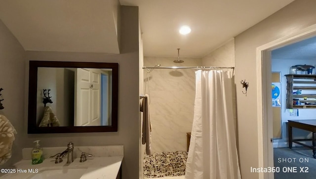 bathroom featuring sink and walk in shower