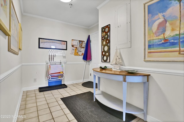 miscellaneous room with ornamental molding and light tile patterned flooring