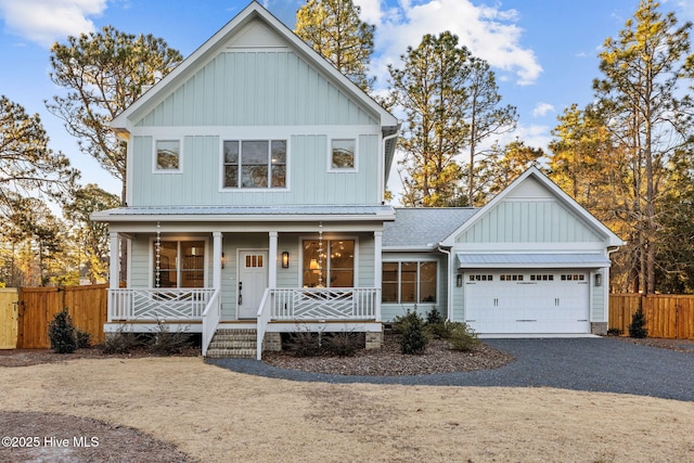 view of front of home with a porch and a garage