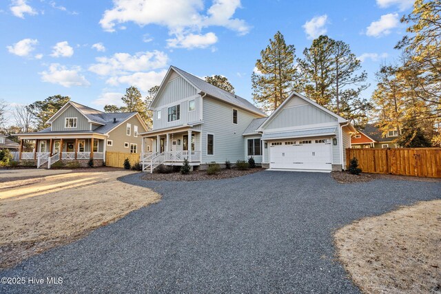 view of front of house with covered porch and a garage