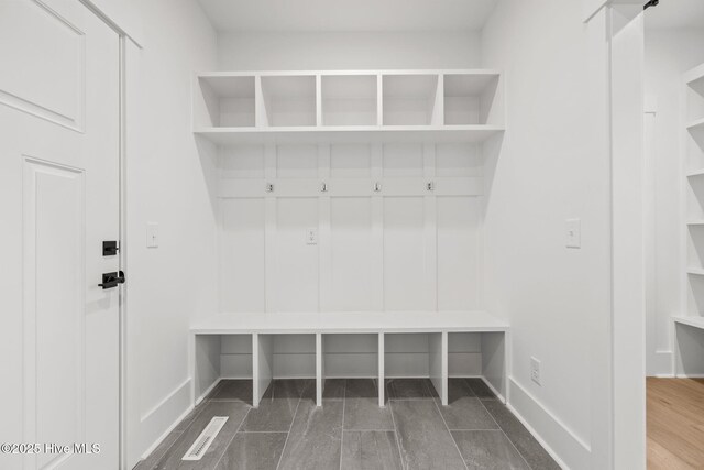 washroom featuring washer hookup, cabinets, and electric dryer hookup