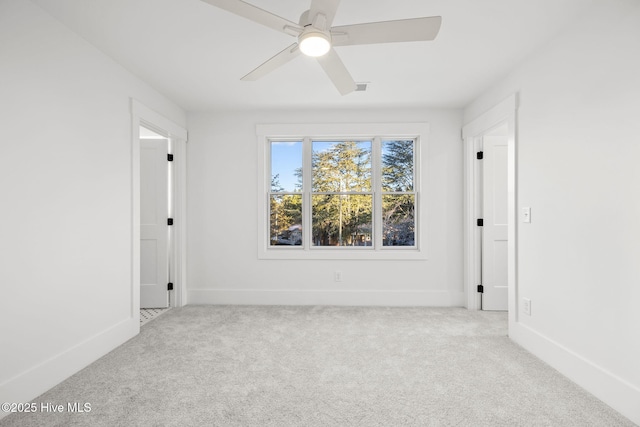 unfurnished room featuring ceiling fan and light colored carpet