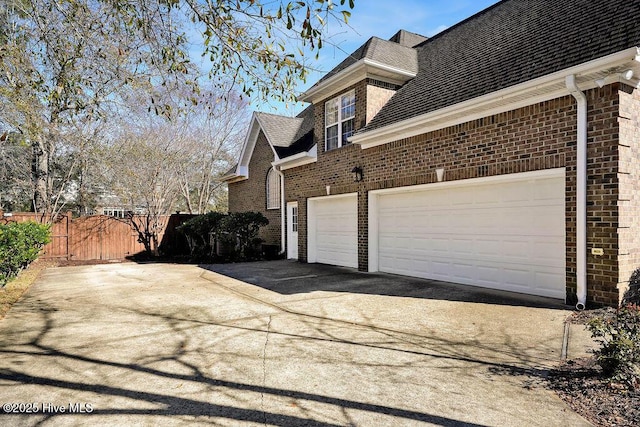 view of property exterior with a garage