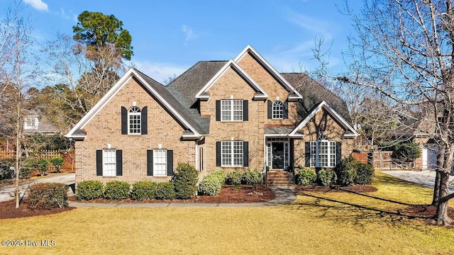 view of property featuring a front lawn