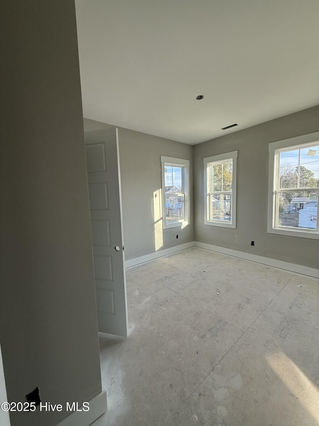 unfurnished room with a wealth of natural light