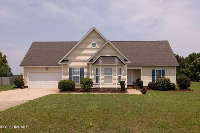 view of front of house with a garage and a front lawn