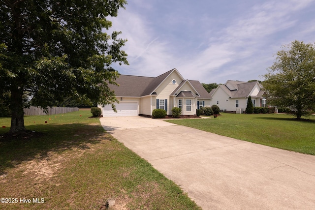 view of front of house featuring a front lawn and a garage