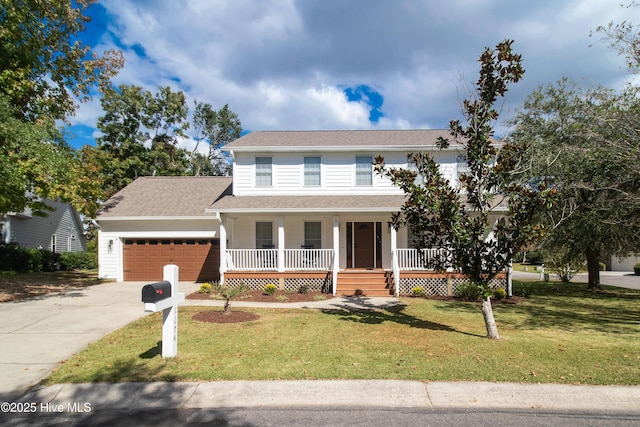 view of front of property featuring a garage, a front lawn, and a porch