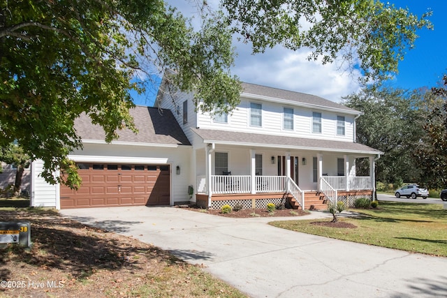 view of front facade with a garage, a front lawn, and a porch