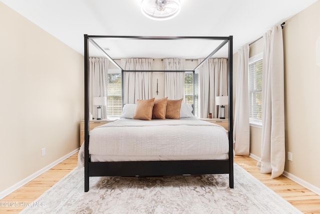 bedroom with hardwood / wood-style floors