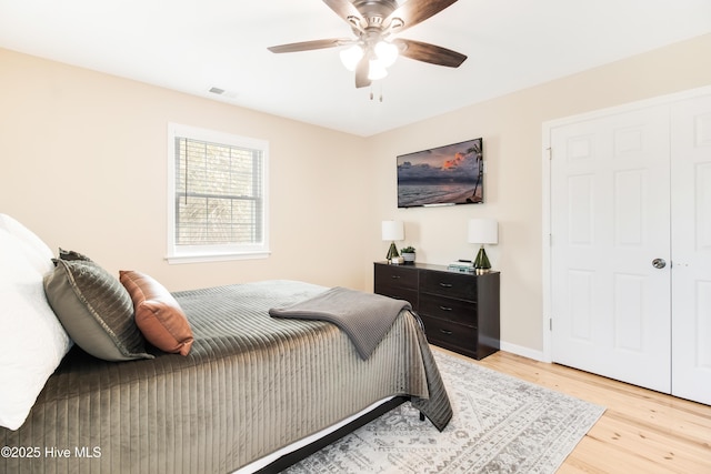 bedroom featuring light wood-type flooring and ceiling fan