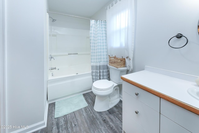 full bathroom with toilet, vanity, hardwood / wood-style floors, and shower / bath combo with shower curtain