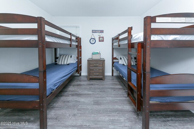 unfurnished bedroom featuring dark hardwood / wood-style floors