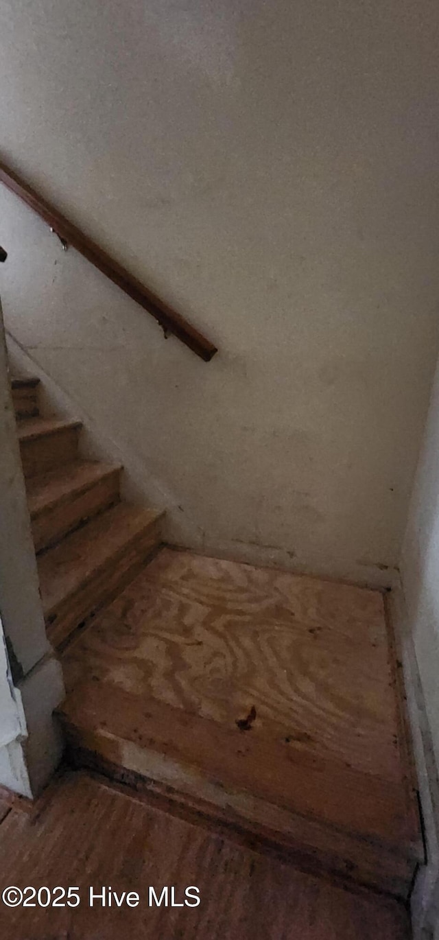 stairway with wood-type flooring