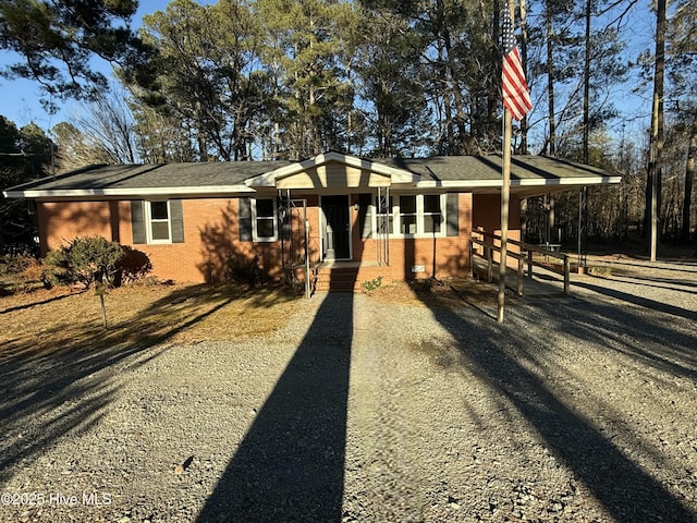 single story home with a carport