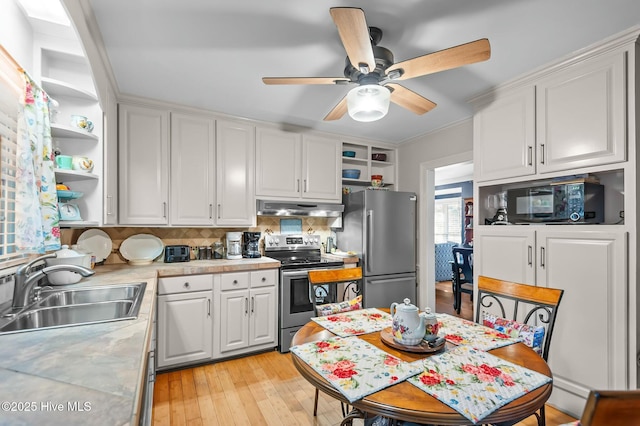 kitchen with sink, white cabinetry, tasteful backsplash, and appliances with stainless steel finishes