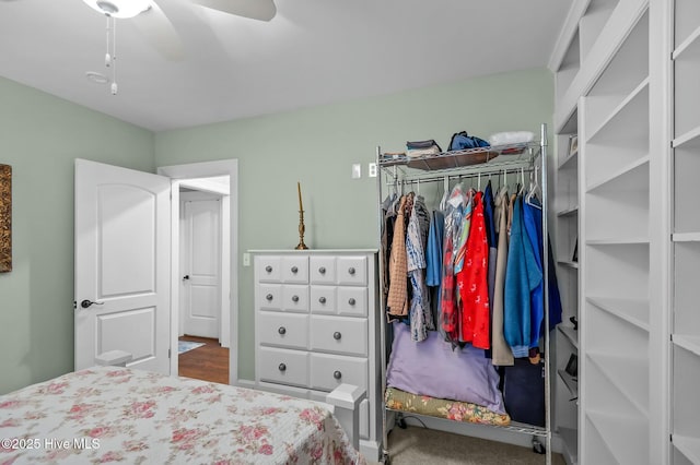 bedroom with ceiling fan, a closet, and carpet floors