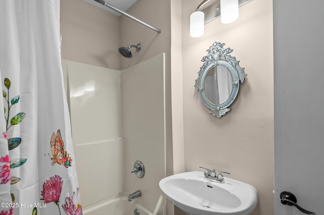 bathroom featuring shower / tub combo and sink