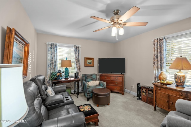 living room featuring ceiling fan and light carpet