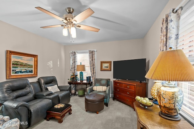 living room featuring ceiling fan and light colored carpet