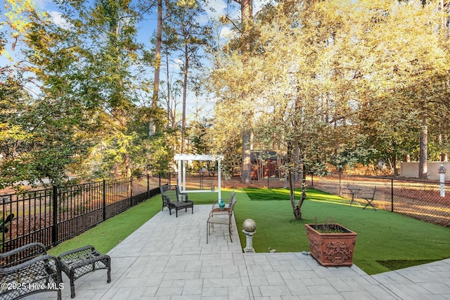 view of home's community with a pergola and a lawn