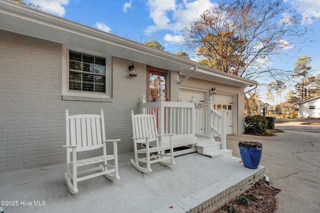 doorway to property with a garage