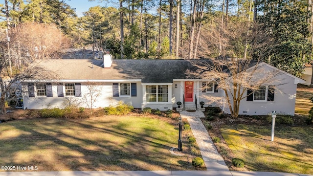 ranch-style home featuring a front lawn