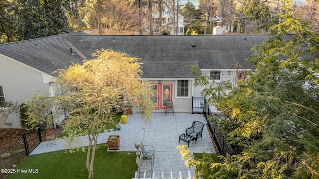 exterior space with a front yard and a patio