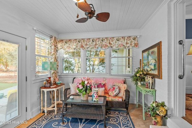 sunroom / solarium featuring ceiling fan and wood ceiling